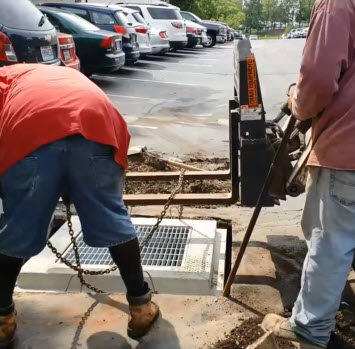 Asphalt company Installing a new storm water sewer Inlet in St Louis MO